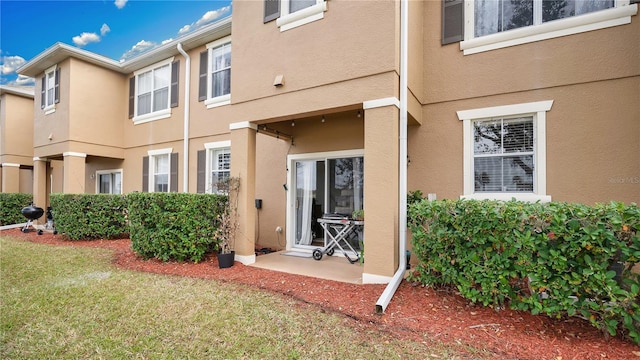 221 Aston Grande Dr, Daytona Beach, FL 32124 - doorway to property with a lawn