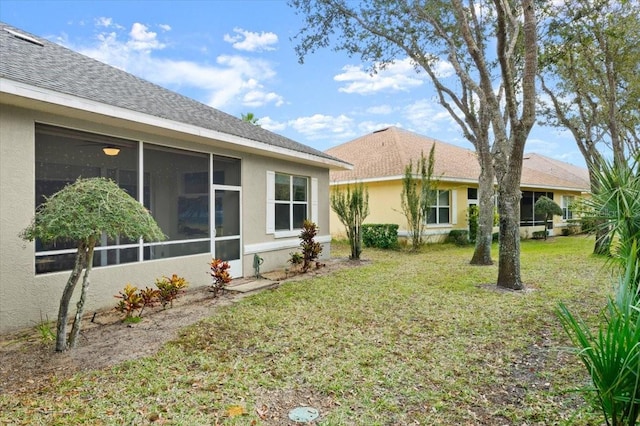 view of yard with a sunroom