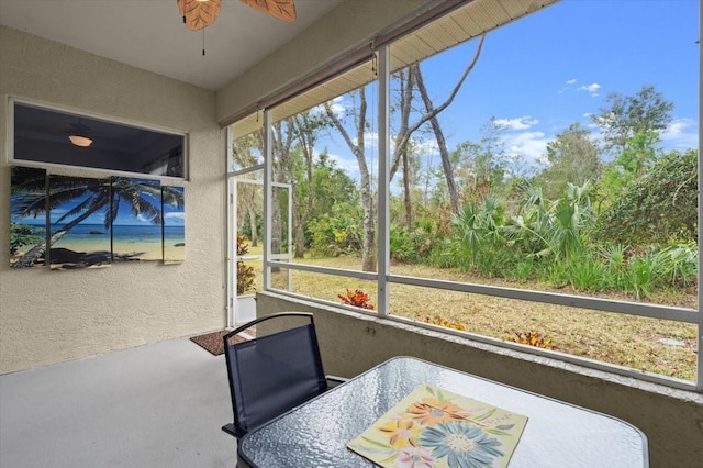 sunroom / solarium with ceiling fan