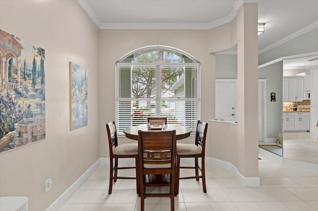 tiled dining area with crown molding