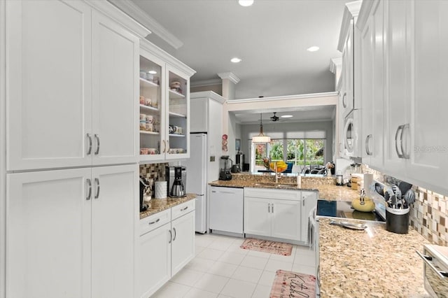 kitchen featuring pendant lighting, sink, white appliances, ornamental molding, and white cabinets