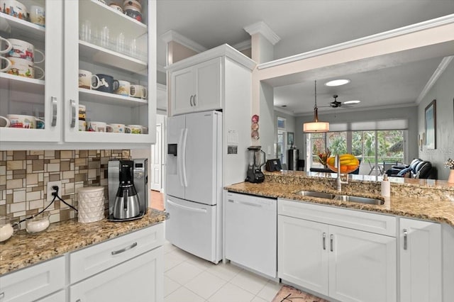 kitchen featuring pendant lighting, sink, white appliances, white cabinetry, and ornamental molding