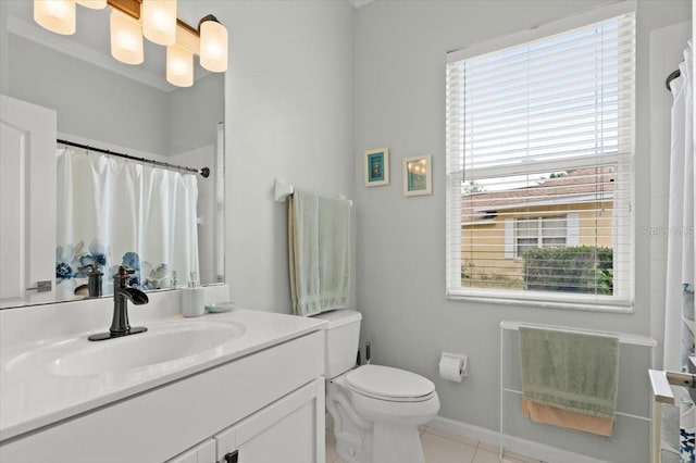 bathroom with tile patterned floors, vanity, and toilet