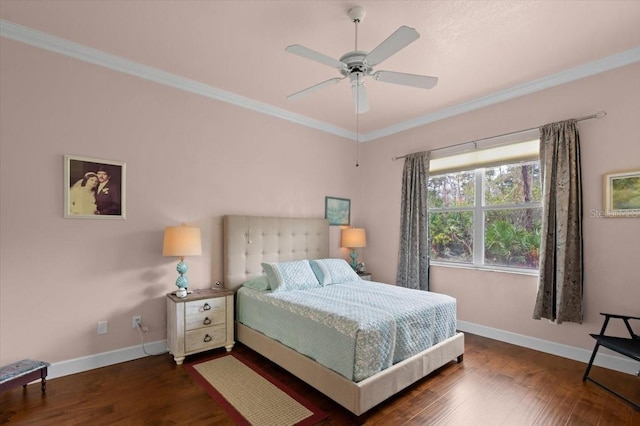 bedroom with ornamental molding, dark hardwood / wood-style floors, and ceiling fan