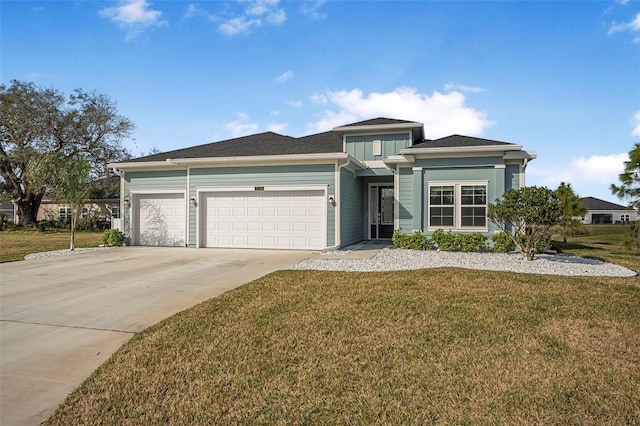 view of front of house featuring a garage and a front lawn