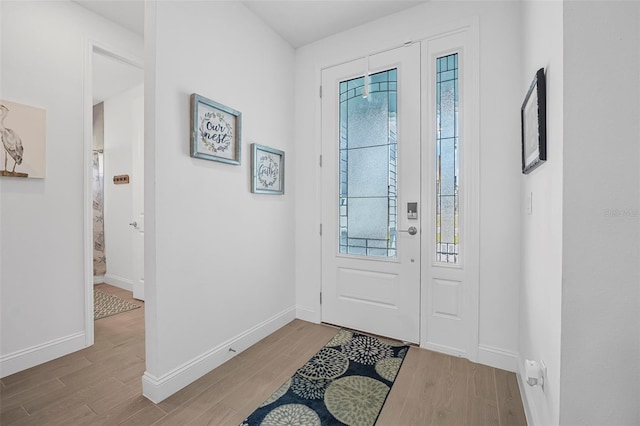 foyer entrance featuring plenty of natural light and light hardwood / wood-style floors