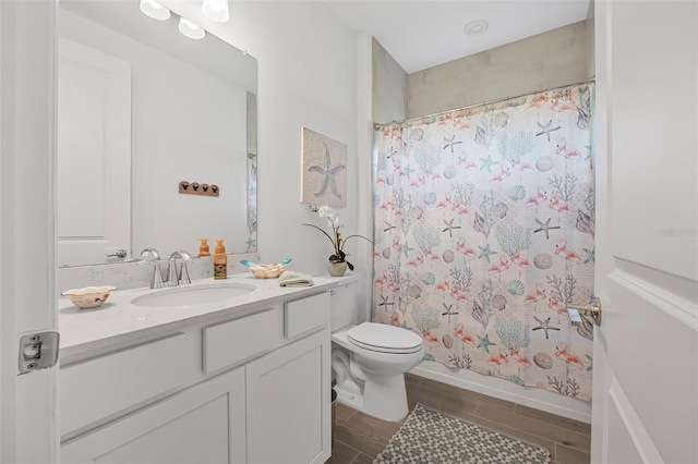 full bathroom with vanity, shower / bathtub combination with curtain, and toilet