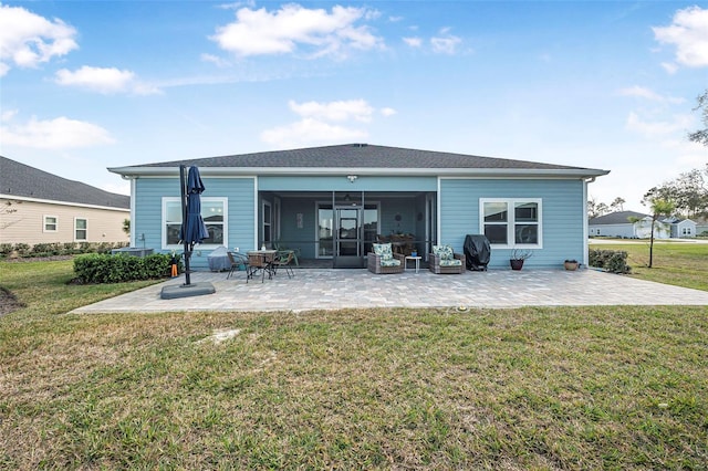 back of house with a yard and a patio area