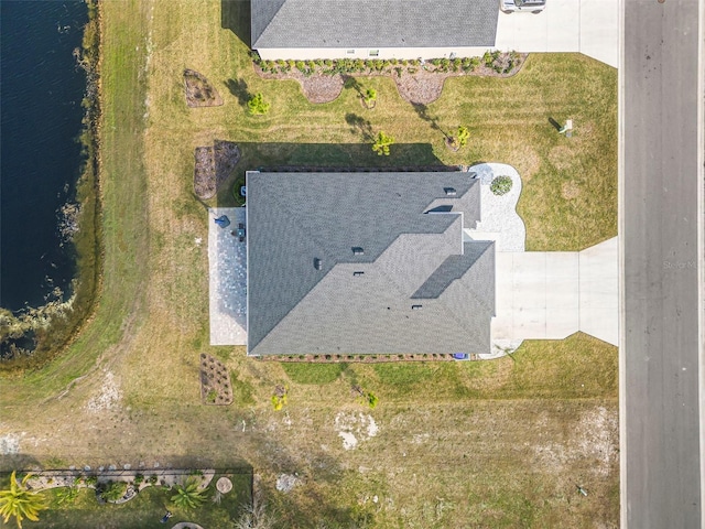 drone / aerial view featuring a water view