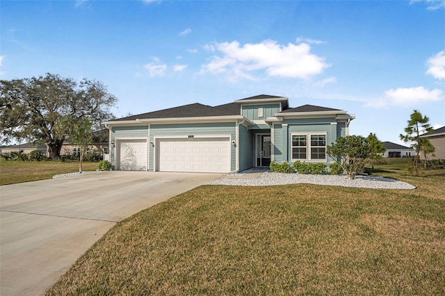 view of front of home with a garage and a front lawn