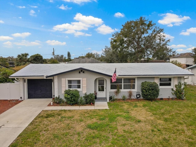 ranch-style house featuring a garage and a front yard