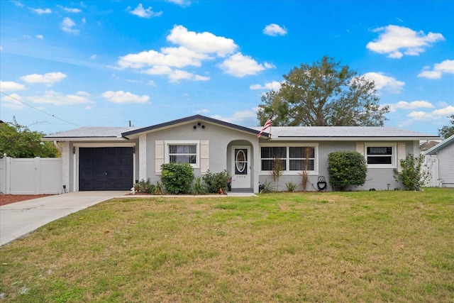 ranch-style home with a garage and a front lawn