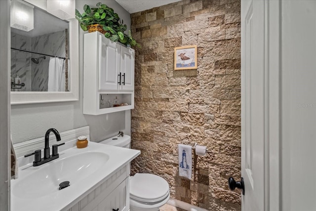 bathroom featuring vanity, toilet, and a shower with shower curtain