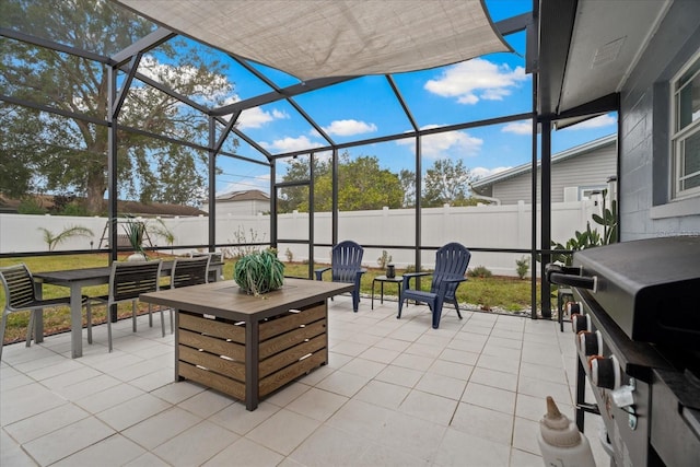 view of patio featuring glass enclosure