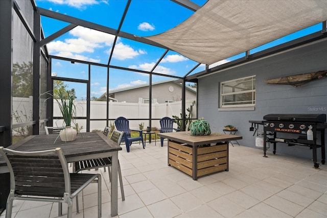 view of patio / terrace featuring area for grilling and a lanai