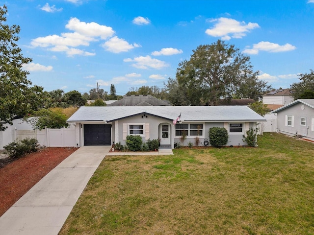 ranch-style home with a garage and a front lawn