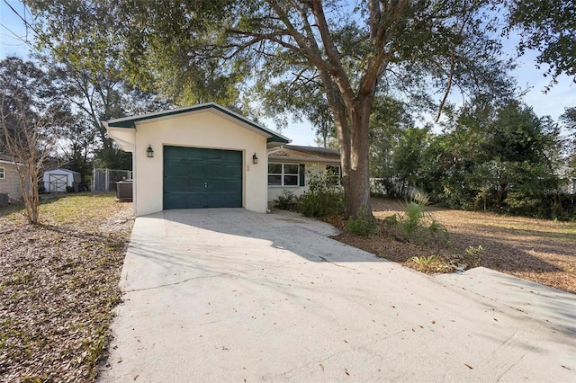 view of front of home featuring a storage shed