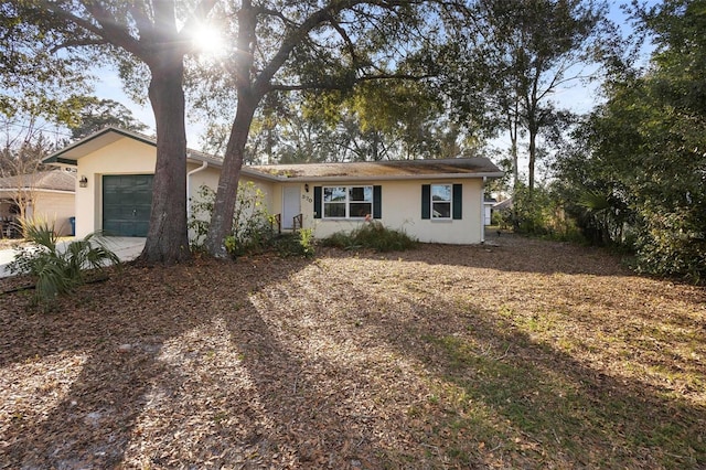 ranch-style home with a garage