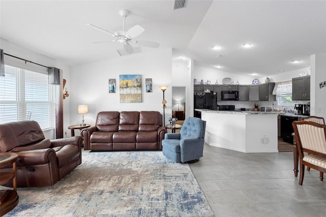 living room featuring lofted ceiling and ceiling fan