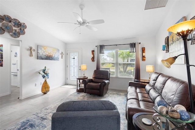 living room featuring ceiling fan and lofted ceiling