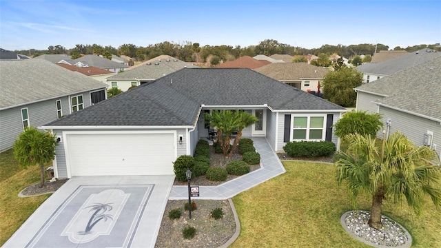 view of front facade with a garage and a front yard