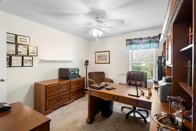 office with light carpet and ceiling fan