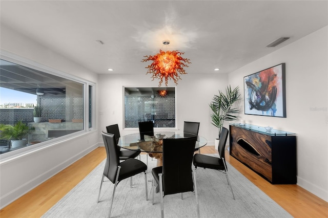 dining space with hardwood / wood-style flooring