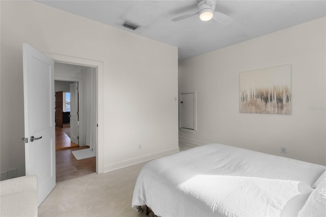 bedroom with light carpet and ceiling fan