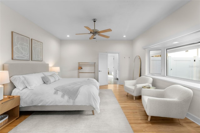 bedroom featuring light hardwood / wood-style floors and ceiling fan