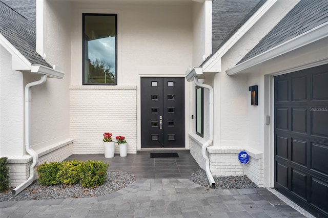 entrance to property featuring a garage