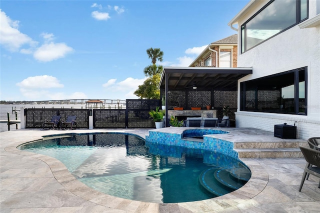 view of pool featuring a patio area and a jacuzzi