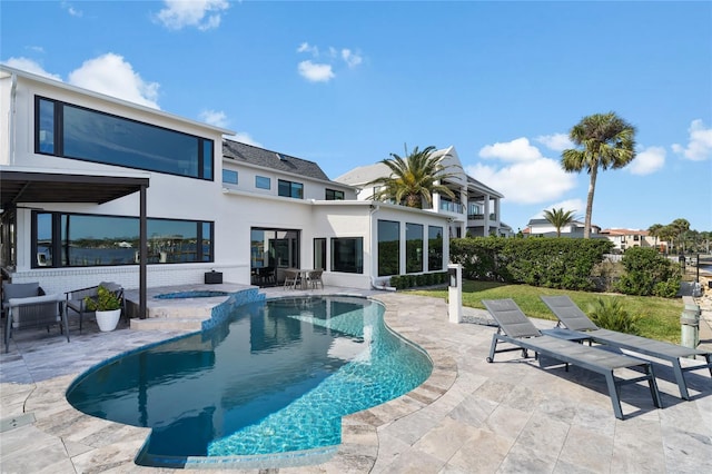 view of swimming pool with a patio area