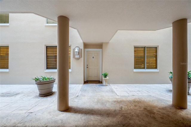 property entrance featuring a patio