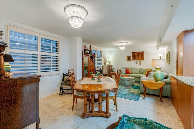 dining space with light tile patterned floors