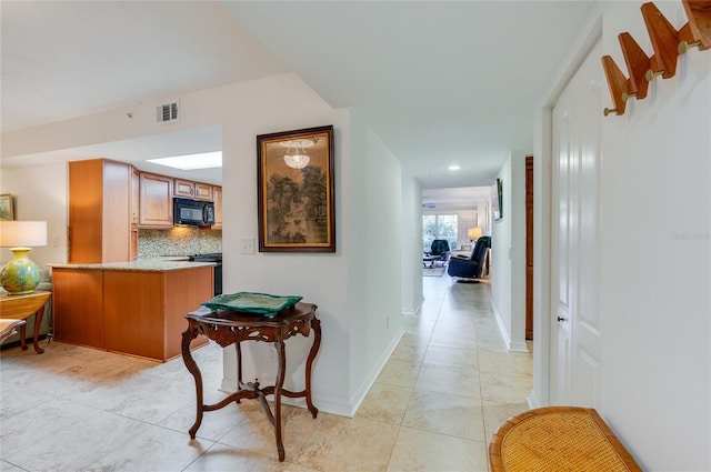 hallway with light tile patterned flooring