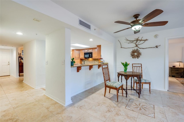 dining area featuring ceiling fan