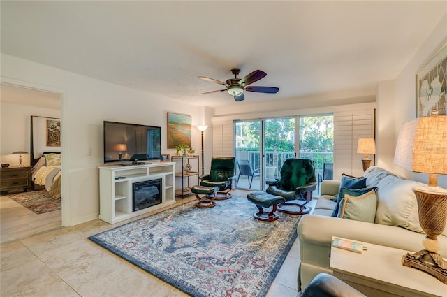 tiled living room with ceiling fan