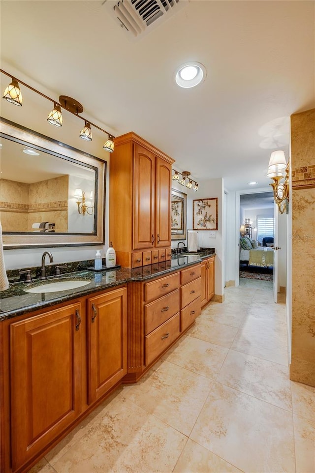 bathroom with vanity and tile patterned floors