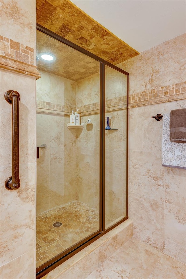 bathroom featuring an enclosed shower