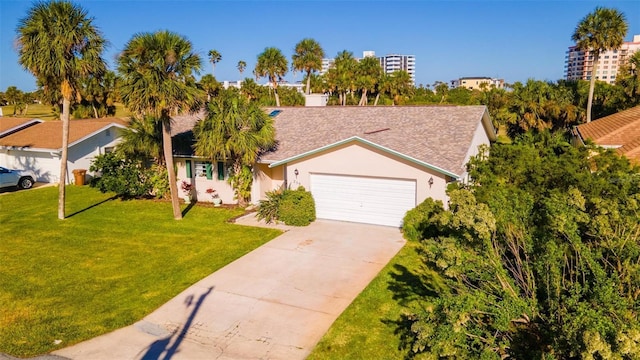 single story home featuring a garage and a front yard