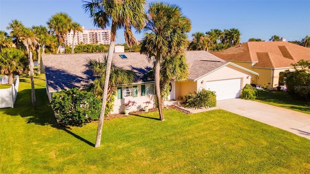 view of front of house with a garage and a front lawn