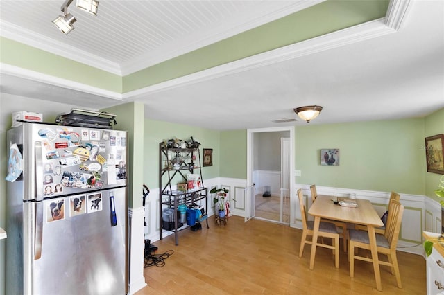 dining area with light hardwood / wood-style floors