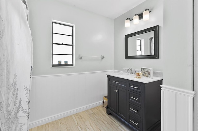 bathroom featuring vanity and hardwood / wood-style floors