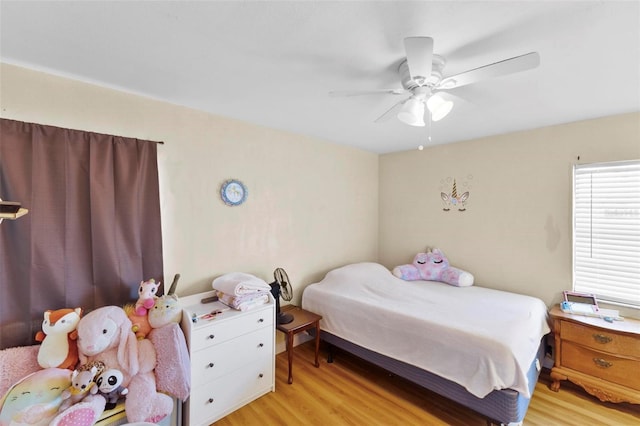 bedroom featuring ceiling fan and light hardwood / wood-style floors