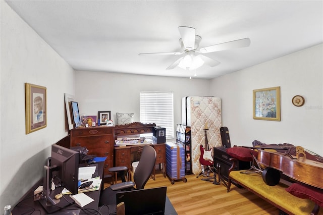 office area with wood-type flooring and ceiling fan