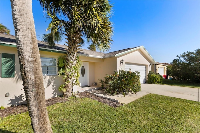 single story home with a garage and a front lawn