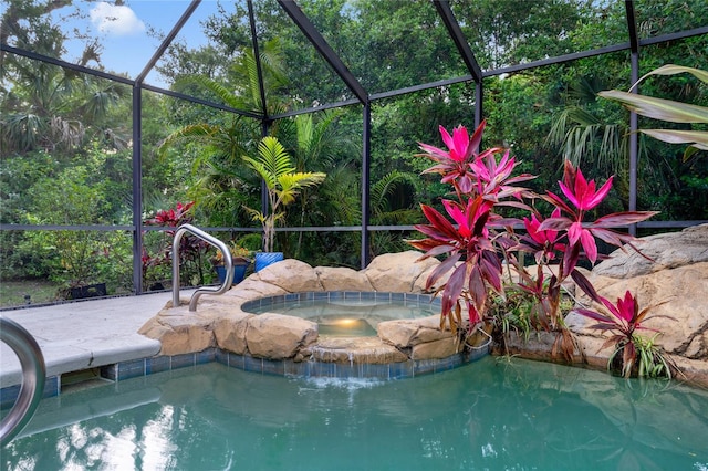 view of pool with an in ground hot tub, a lanai, and a patio