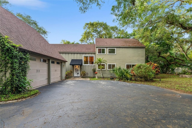 split level home featuring a garage