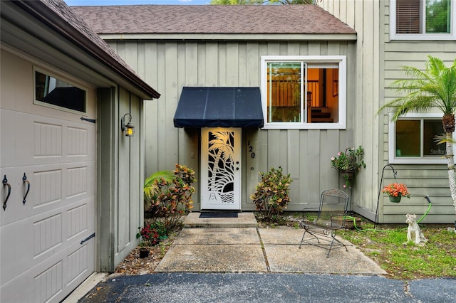 property entrance with a garage