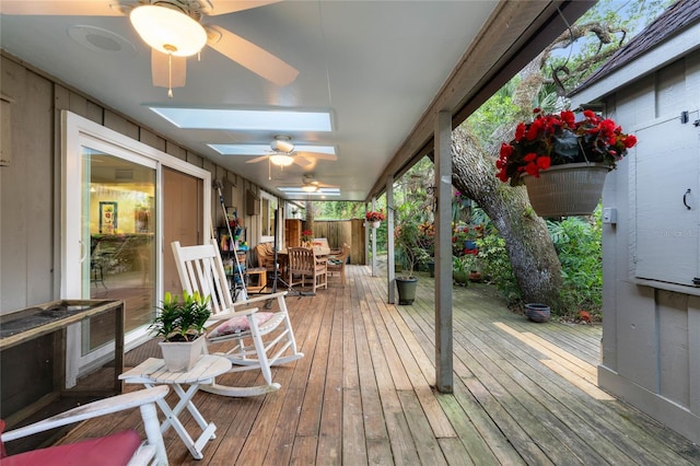 wooden deck featuring ceiling fan